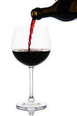 Sparkling red wine pour in glass isolated on white