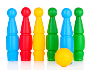 Colorful plastic skittles of toy bowling isolated on white