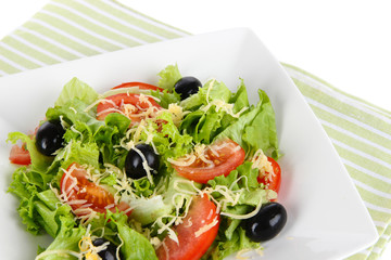 Light salad on plate close-up