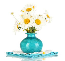 Beautiful bouquet chamomiles in vase isolated on white