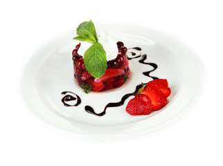 Tasty jelly dessert with fresh berries, isolated on white