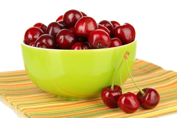 Cherry berries in bowl isolated on white