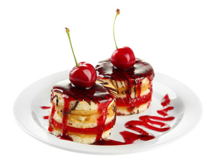 Tasty biscuit cakes with jam and berries