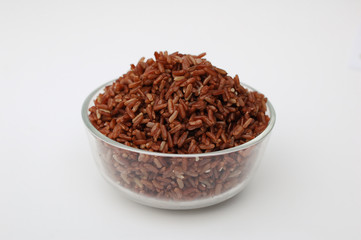 Cooked red rice in glass bowl