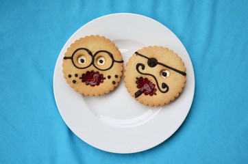 comic pastries "professor" and "pirate" on the plate