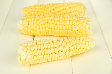 Fresh corn on wooden background