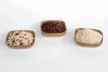 3 bowls of raw rice; brown, red, and mixed rice