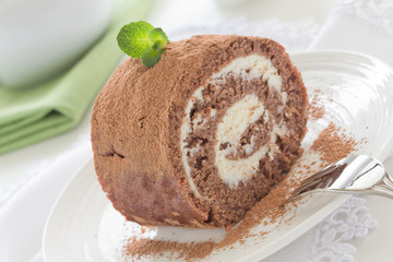 Chocolate roll with cream.