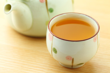 Cup of tea with teapot