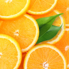 Stack of orange fruit slices background.