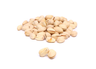 Two pistachios and hill of pistachios.