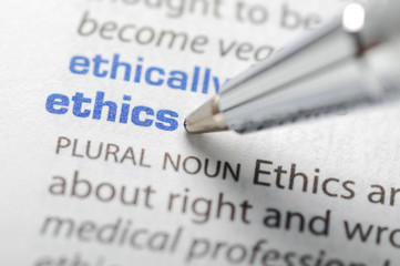 photo from a dictionary with the words ethics and ethically in blue