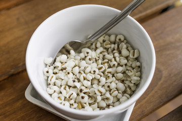 Variety of cereals in white bowl