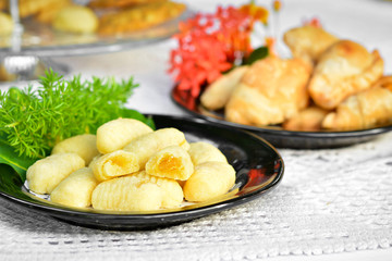 worm cookies on a black dish