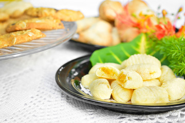 worm cookies on a black dish