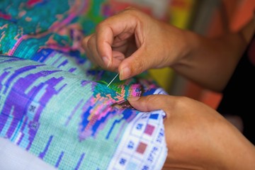 hand with needle embroidery in China