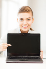 businesswoman with laptop in office