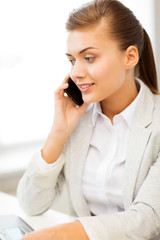 businesswoman with smartphone in office