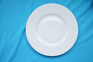 white plate on a blue background