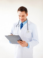 male doctor writing prescription