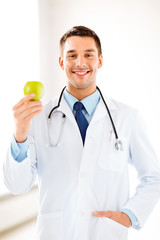 male doctor with green apple