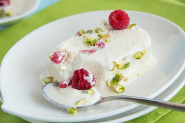 Yoghurt Semifreddo with raspberry and pistachio.