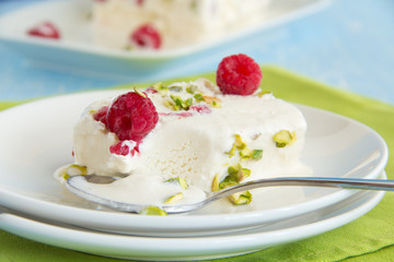 Yoghurt Semifreddo with raspberry and pistachio.