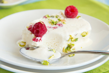 Yoghurt Semifreddo with raspberry and pistachio.