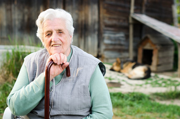 Portrait of the elderly woman. Outdoors