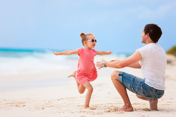 Father and daughter at beach