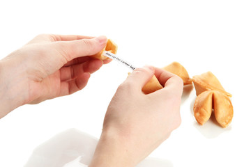 Woman holding fortune cookie, isolated on white