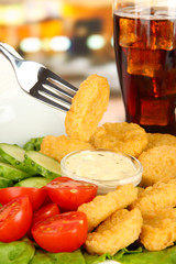 Fried chicken nuggets with vegetables,cola and sauce isolated