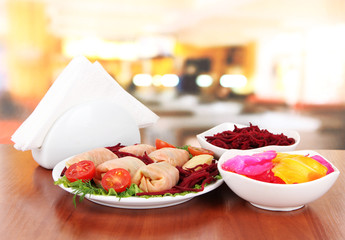 Stuffed cabbage rolls on table in cafe