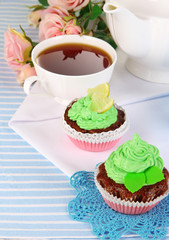 Beautiful cupcakes on dining table close-up