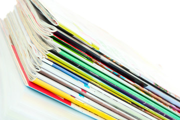 Many magazines isolated on white