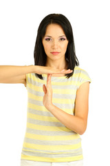 Girl showing time out sign isolated on white