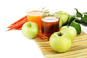 Glasses of juice, apples and carrots, isolated on white
