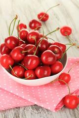 Cherry berries on wooden table close up