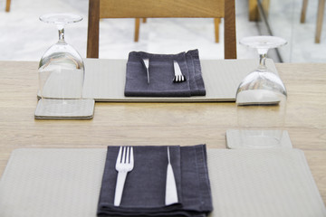 Fork and knife on a grey tablecloth