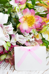 alstroemeria flowers with a white card