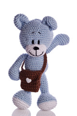 blue teddy bear with brown school bag