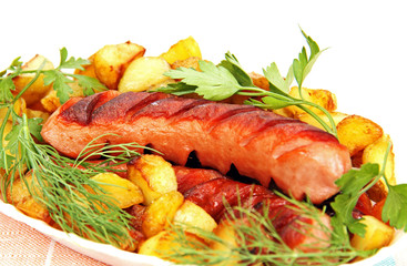 grilled sausage with garnish on the plate.