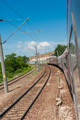 Scenic railroad in rural area and blue sky with white clouds