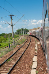 Scenic railroad in rural area and blue sky with white clouds