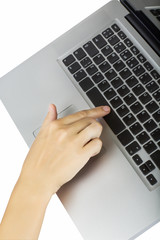 Fototapeta na wymiar laptop with woman hand isolated on white background