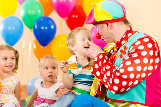 Happy Kid Boy And Clown On Birthday Party