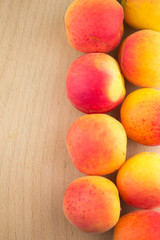 Fresh natural apricot in a row to background