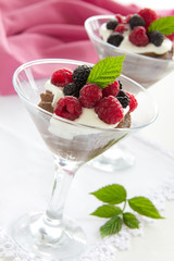 Chocolate mousse with raspberries and cream.