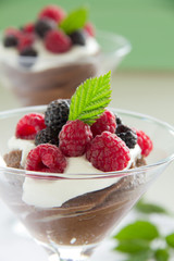 Chocolate mousse with raspberries and cream.
