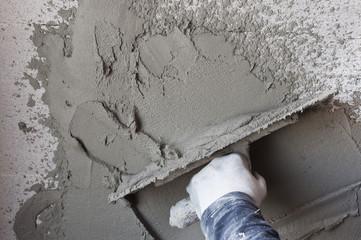 Construction site - Worker performs internal plaster
